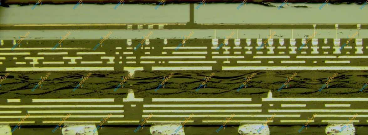Polished cross-section through a package substrate: pale copper layers, vias, and solder joints on a dark field